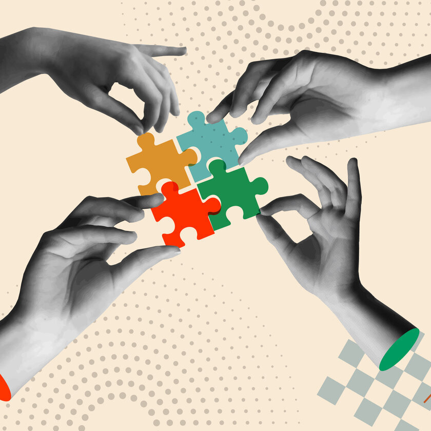Hände, die bunte Puzzleteile halten (Retro-Collage).
